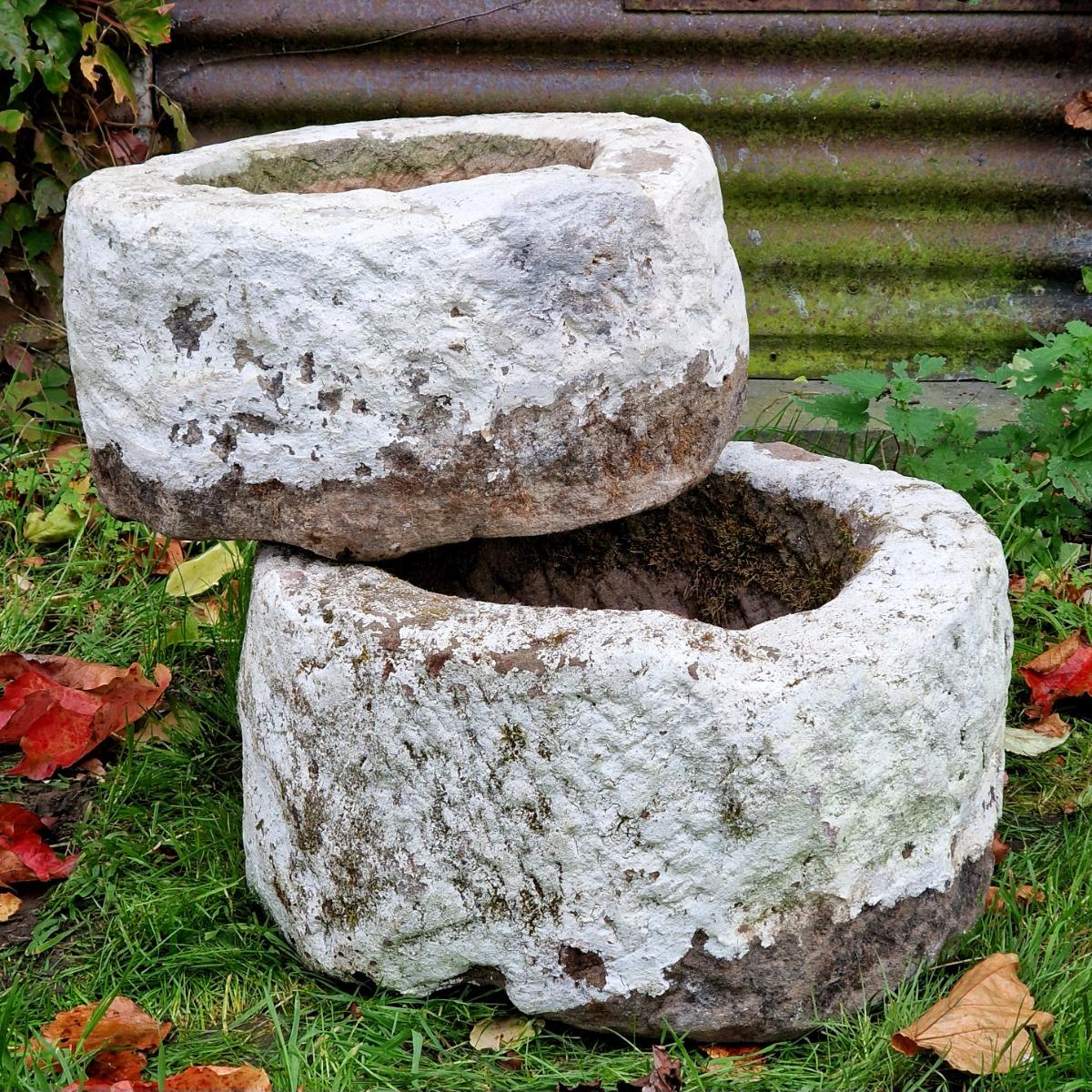 2 handcarved primitive stone planters