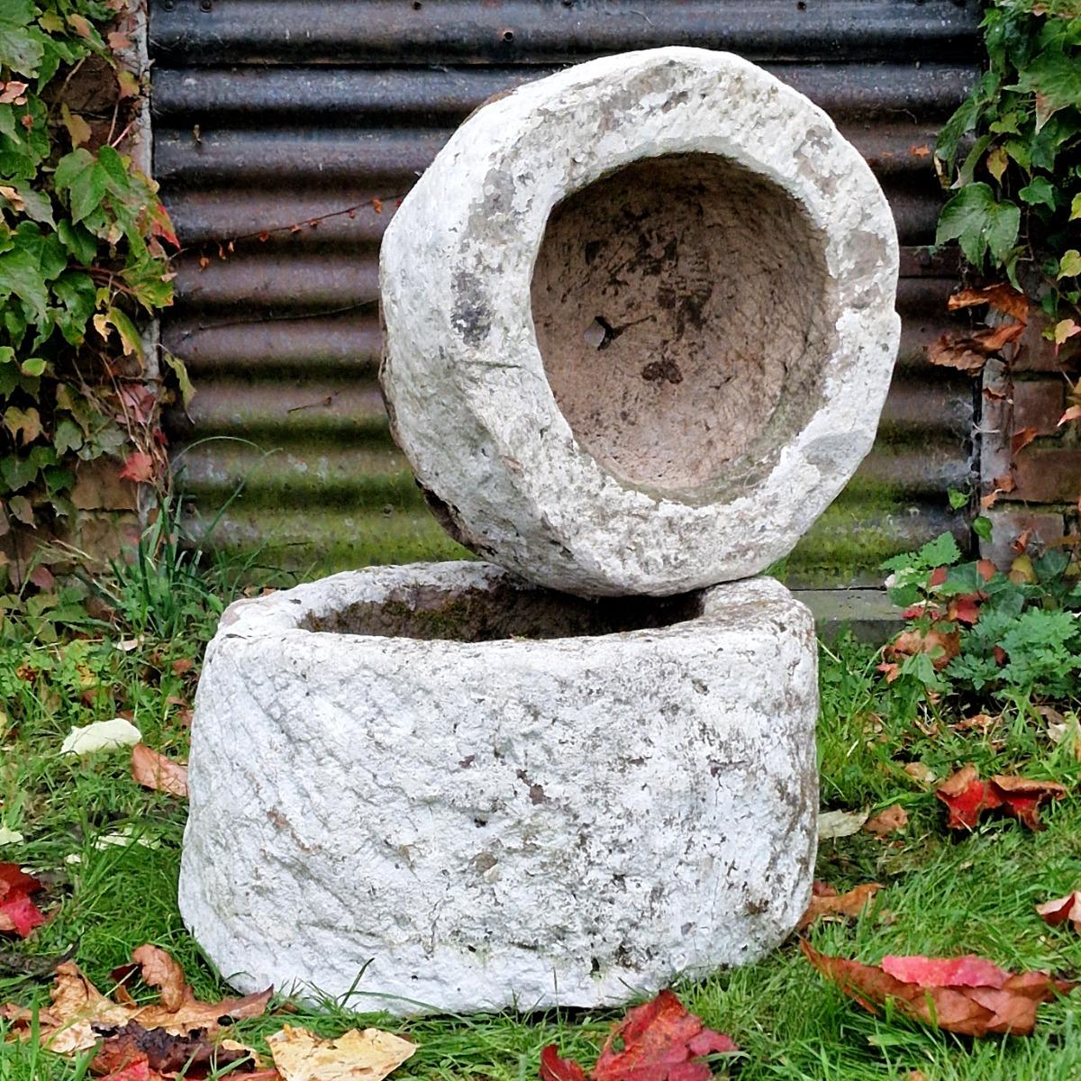 2 handcarved primitive stone planters