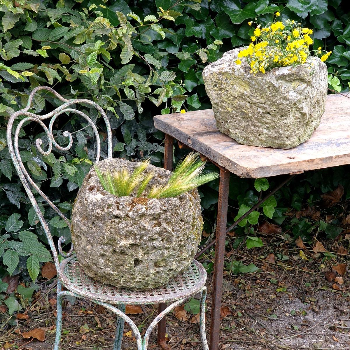 2 primitive stone planters