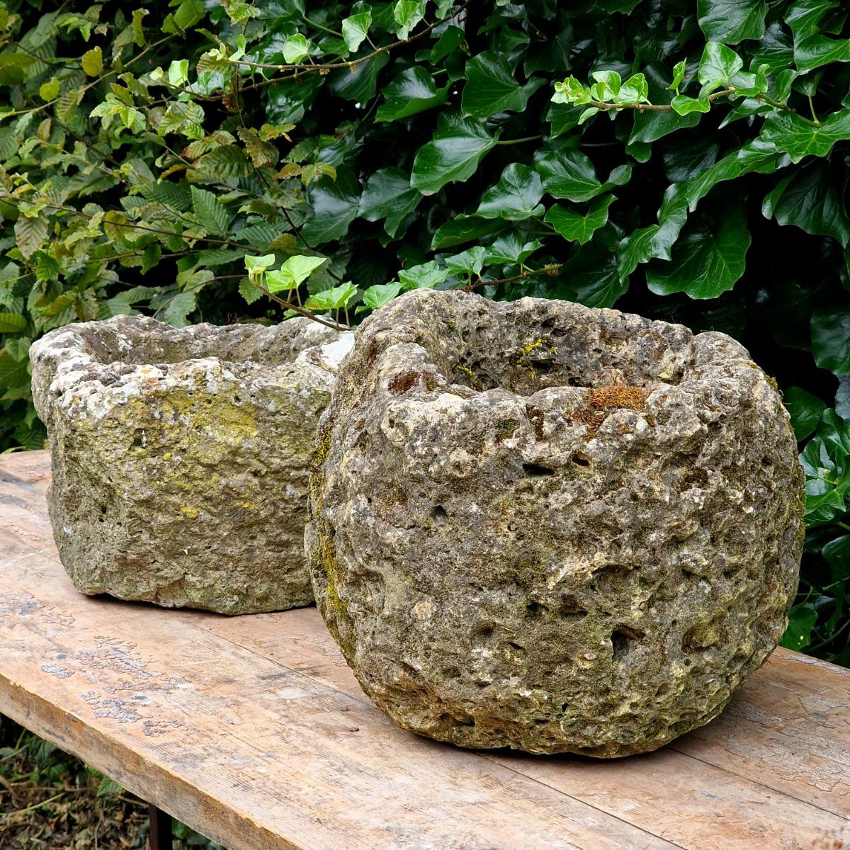 2 primitive stone planters