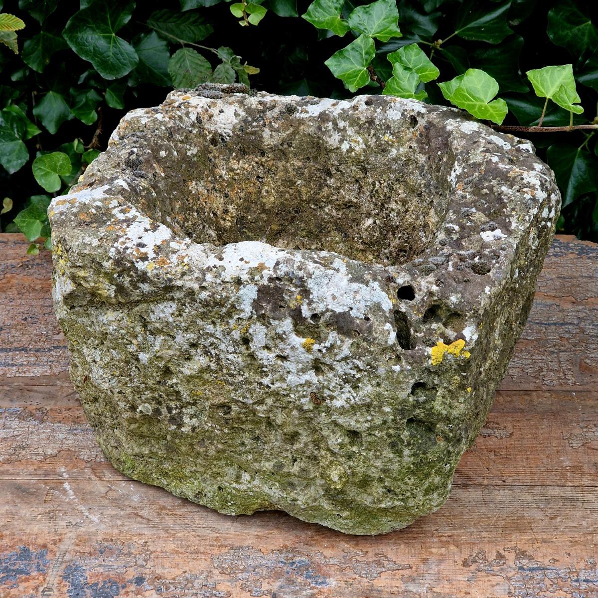 2 primitive stone planters