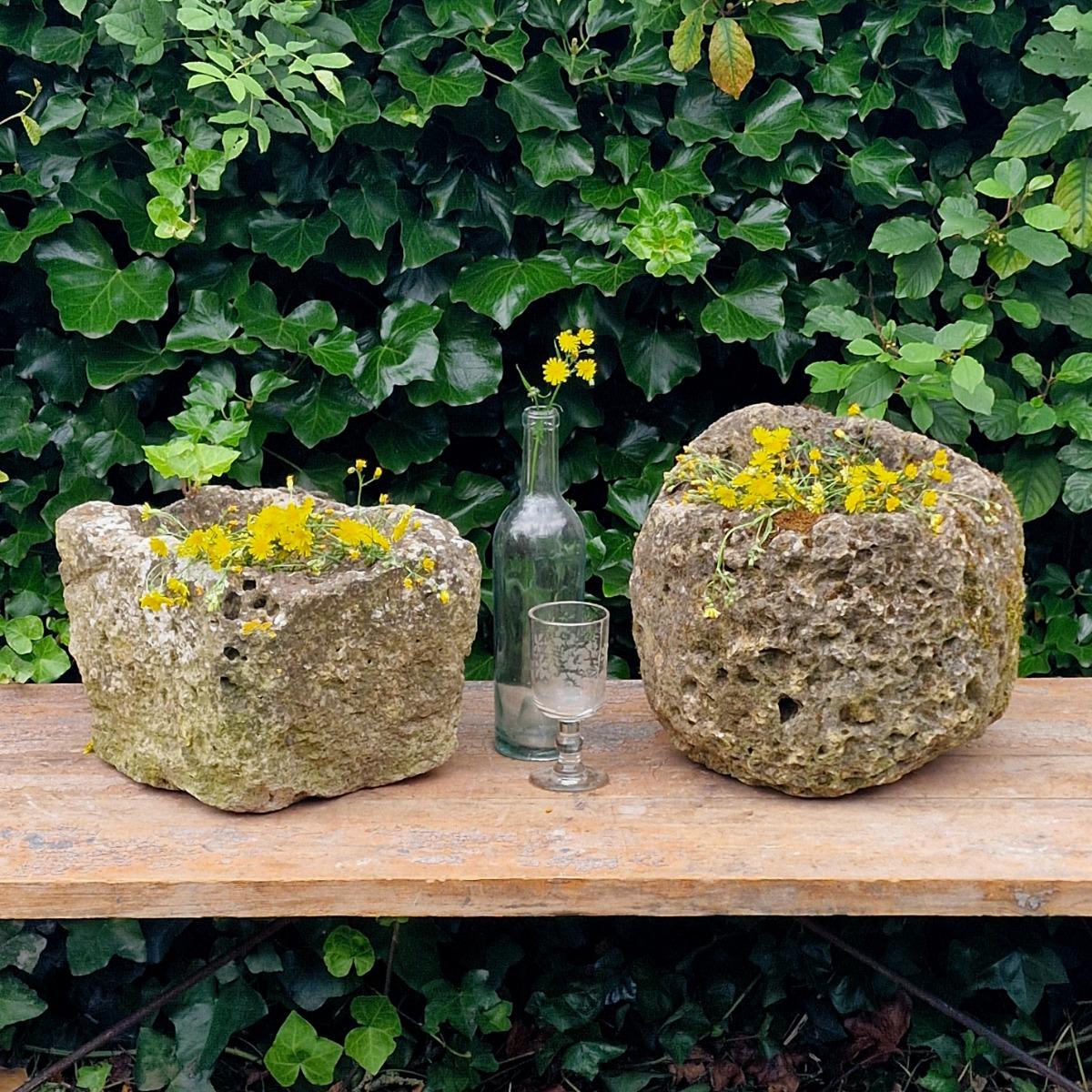 2 primitive stone planters