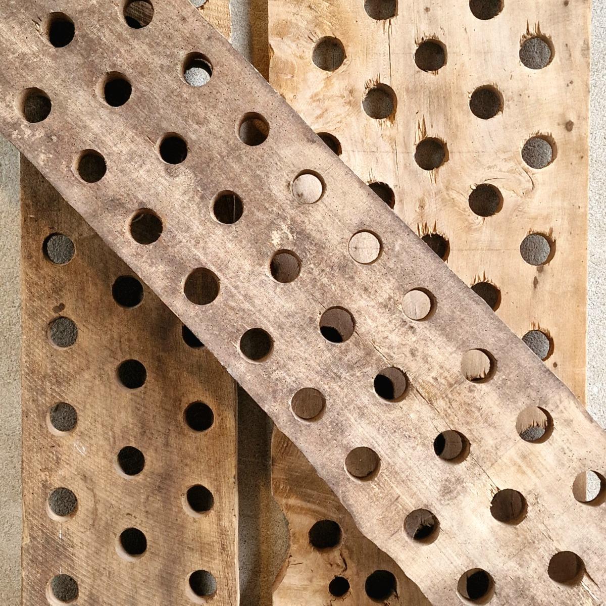 3 perforated wooden shelves