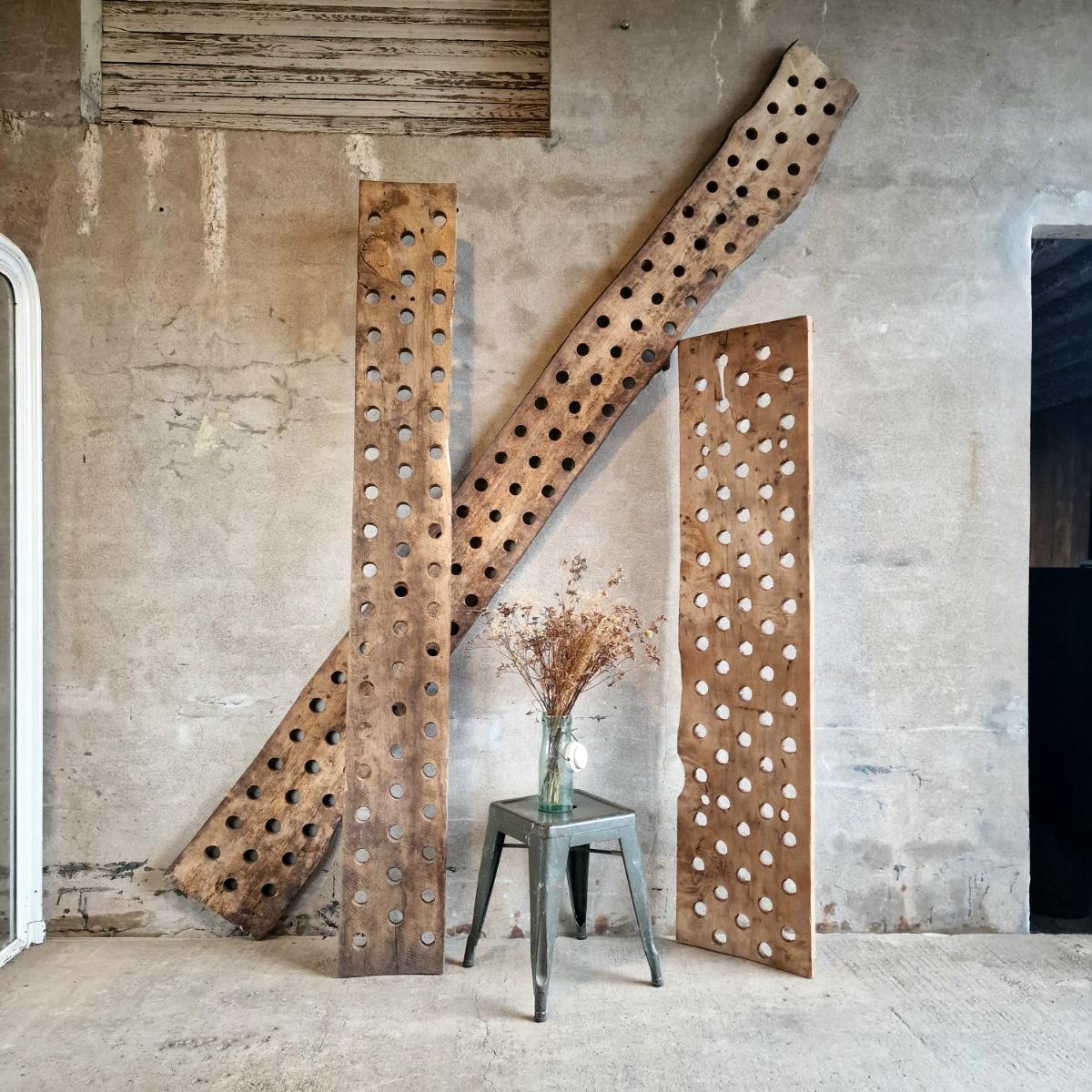 3 perforated wooden shelves