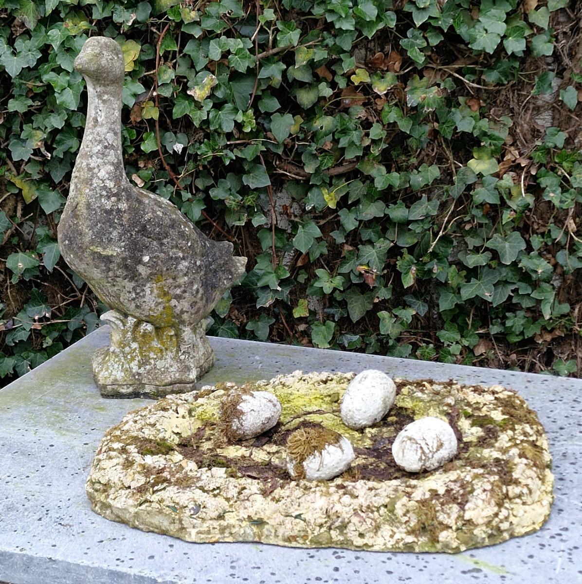 Cast stone goose with nest and eggs