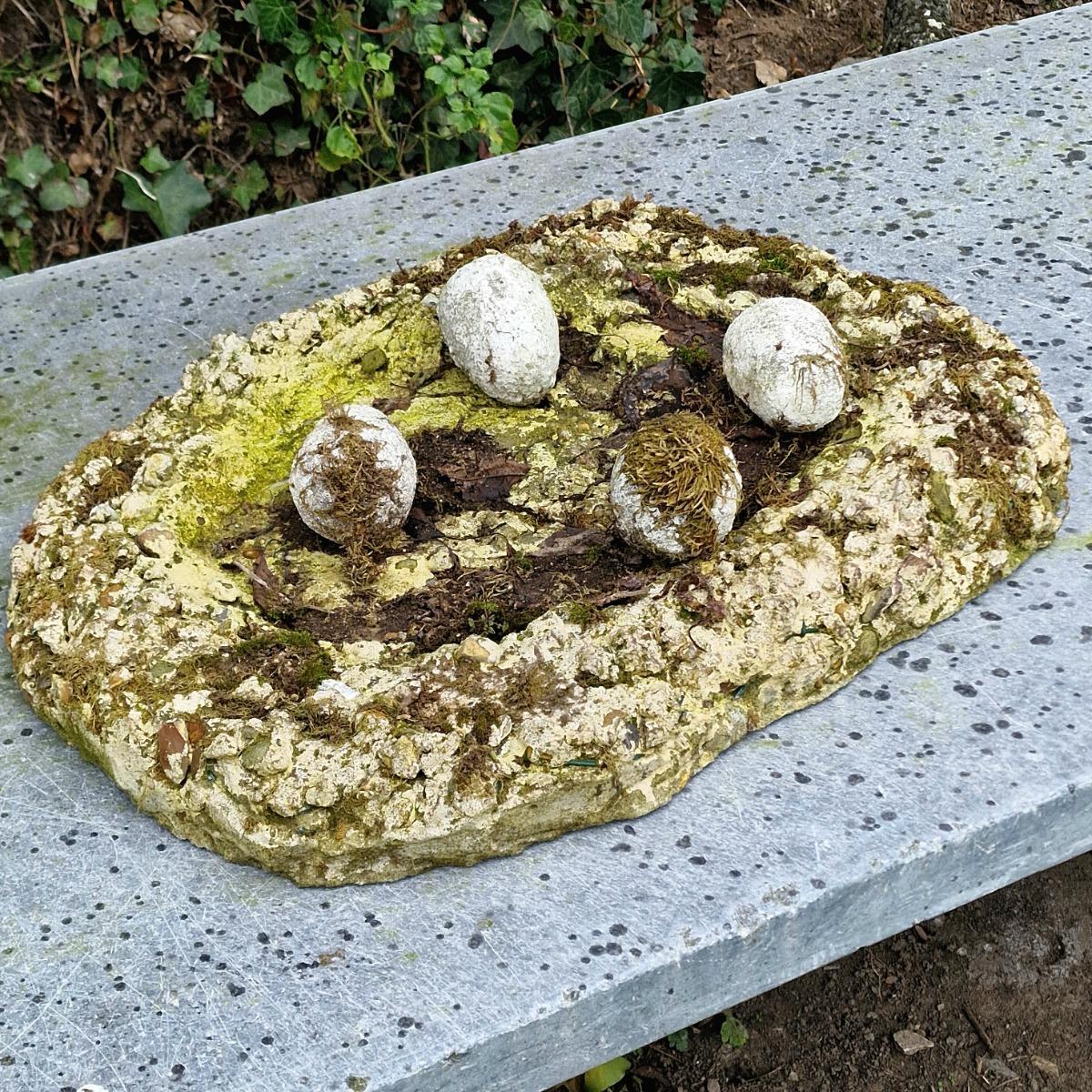 Cast stone goose with nest and eggs