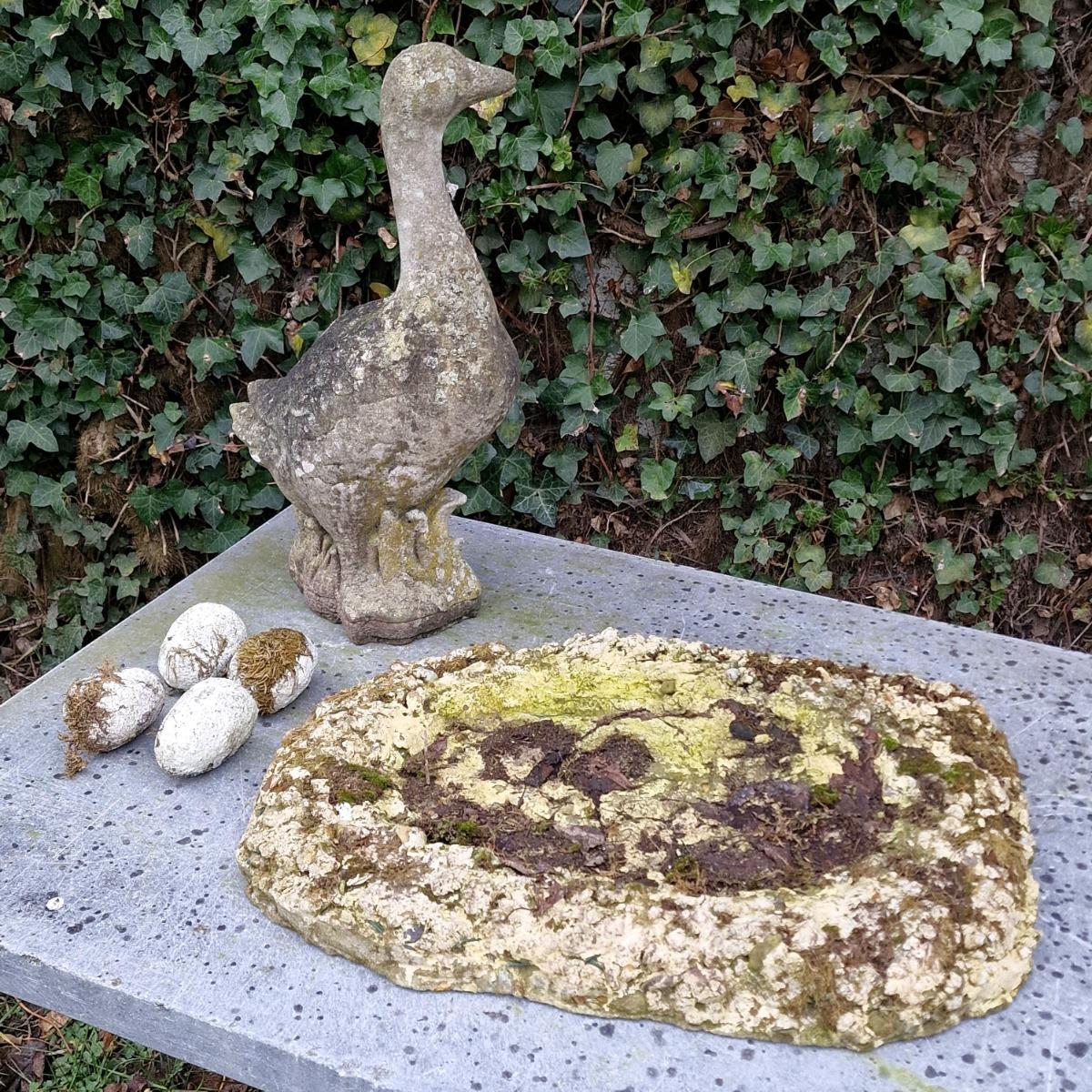 Cast stone goose with nest and eggs