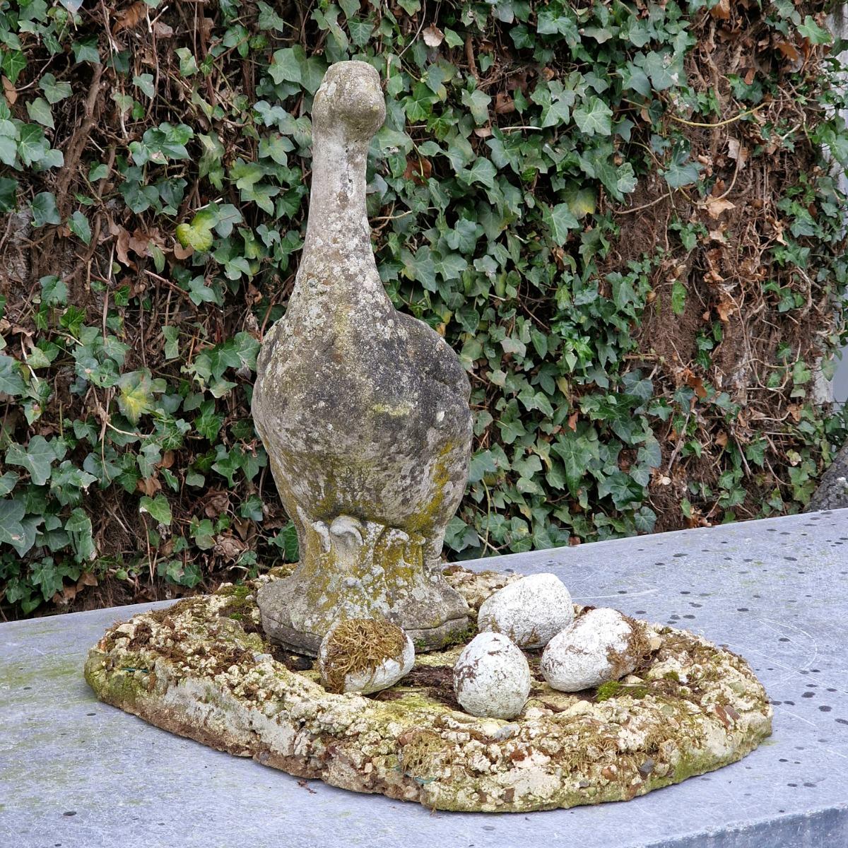 Cast stone goose with nest and eggs