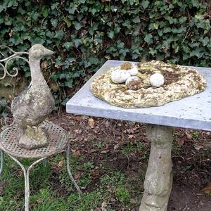 Cast stone goose with nest and eggs