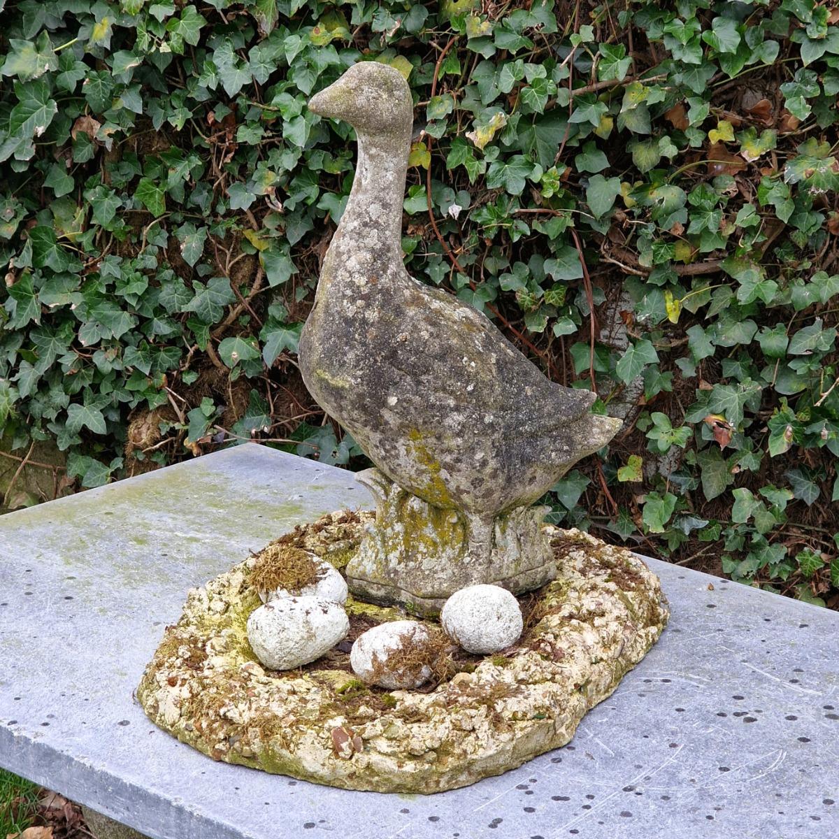 Cast stone goose with nest and eggs