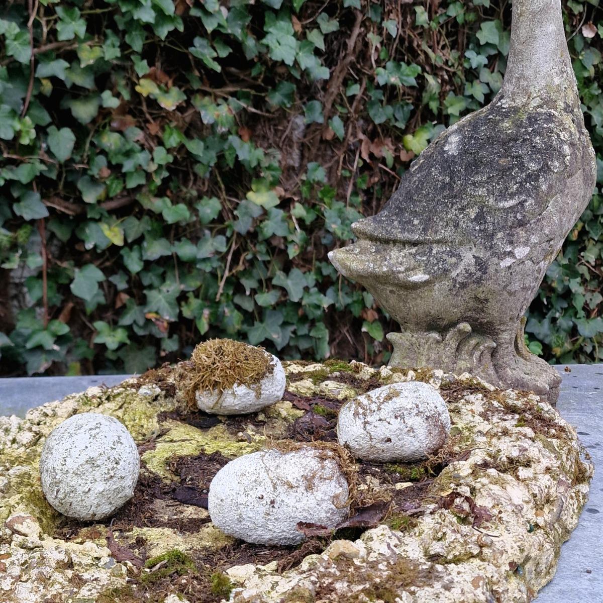 Cast stone goose with nest and eggs