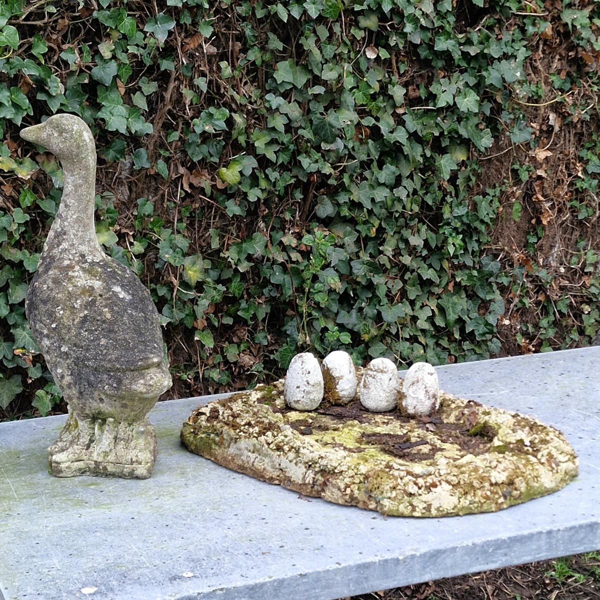 Cast stone goose with nest and eggs