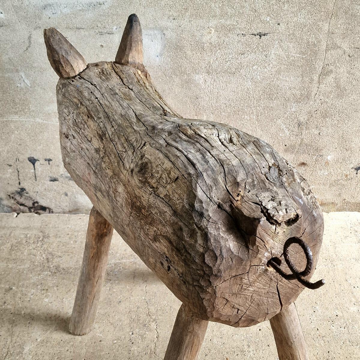 Life-size primitive pig sculpture