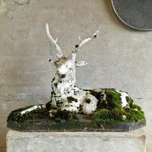 Mossy cast stone deer