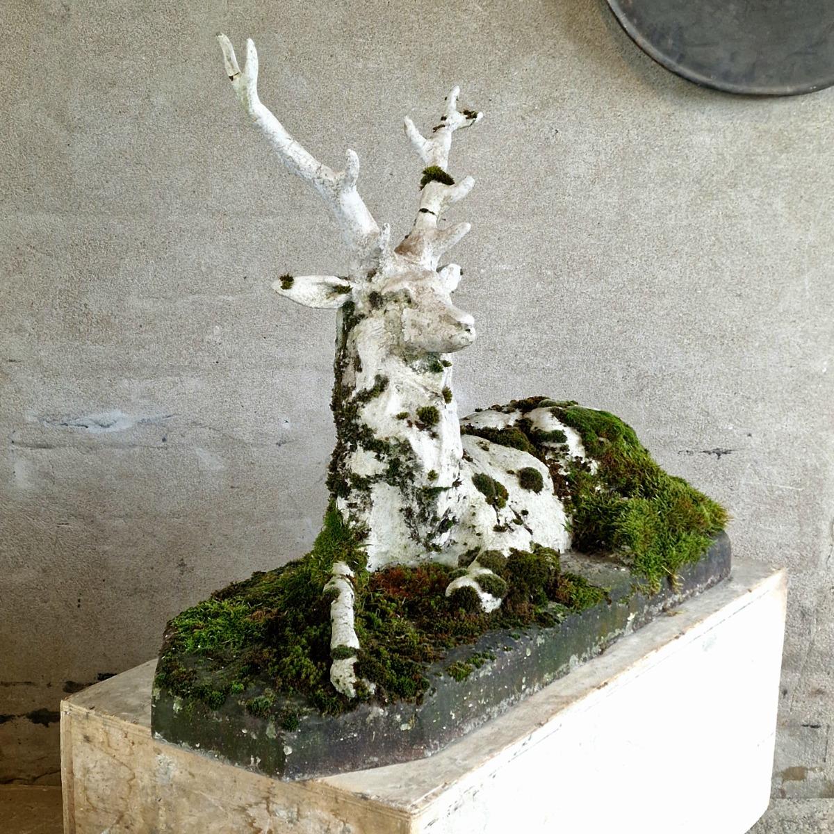 Mossy cast stone deer