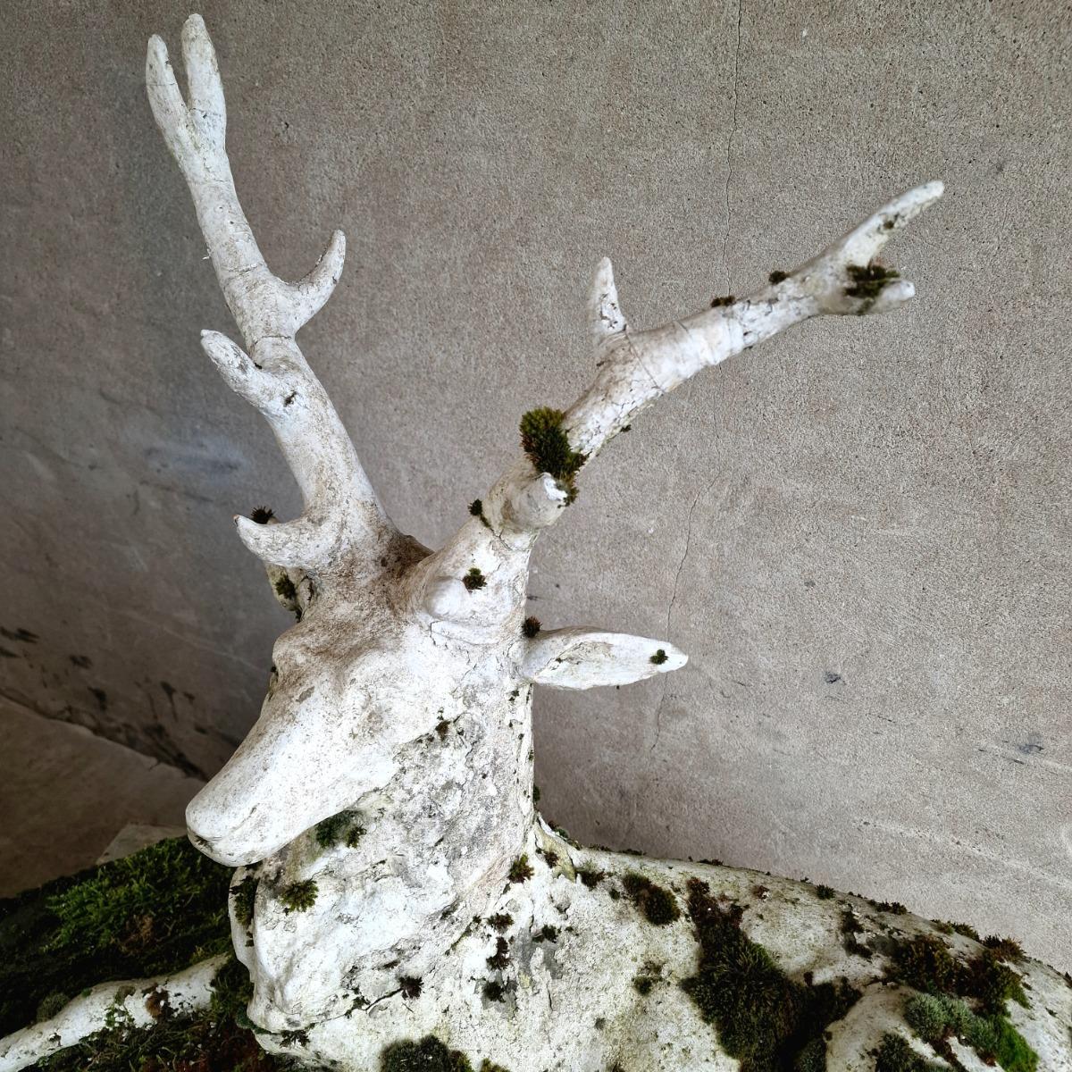 Mossy cast stone deer