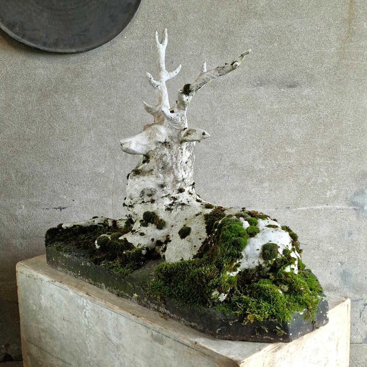 Mossy cast stone deer