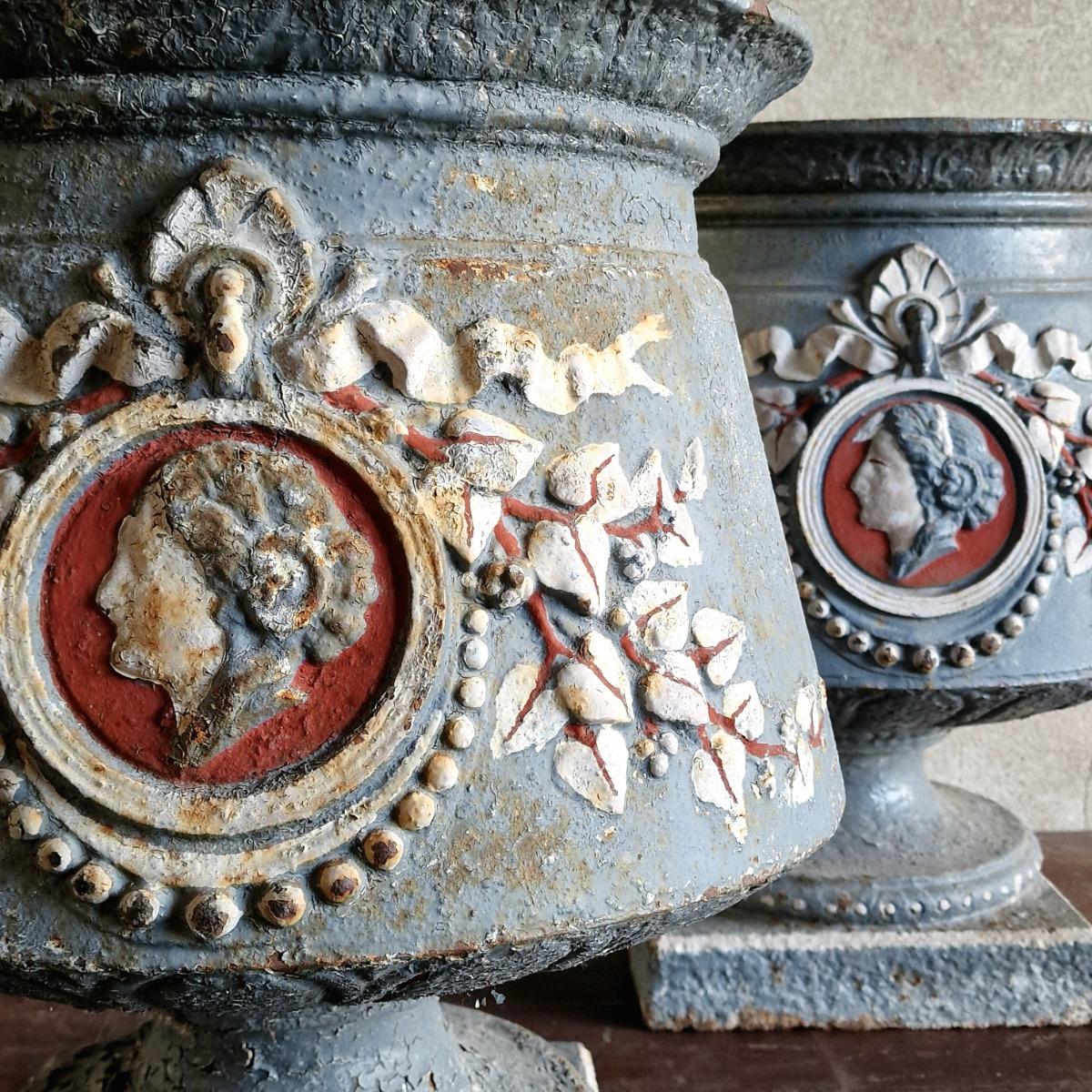 Pair of 19thC painted cast iron urns