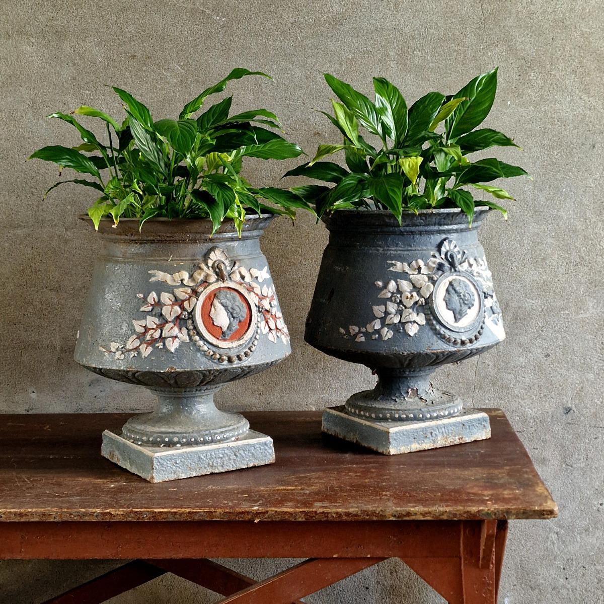 Pair of 19thC painted cast iron urns