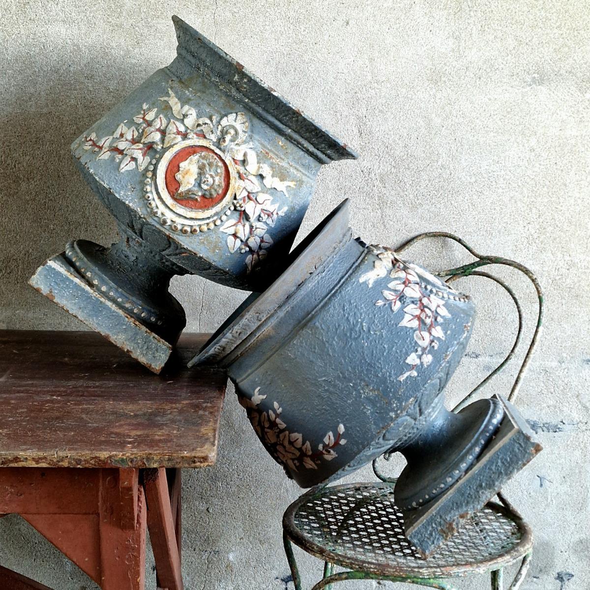 Pair of 19thC painted cast iron urns