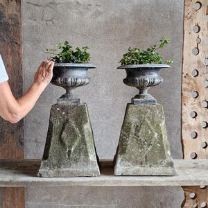 Pair of enamelled urns on base