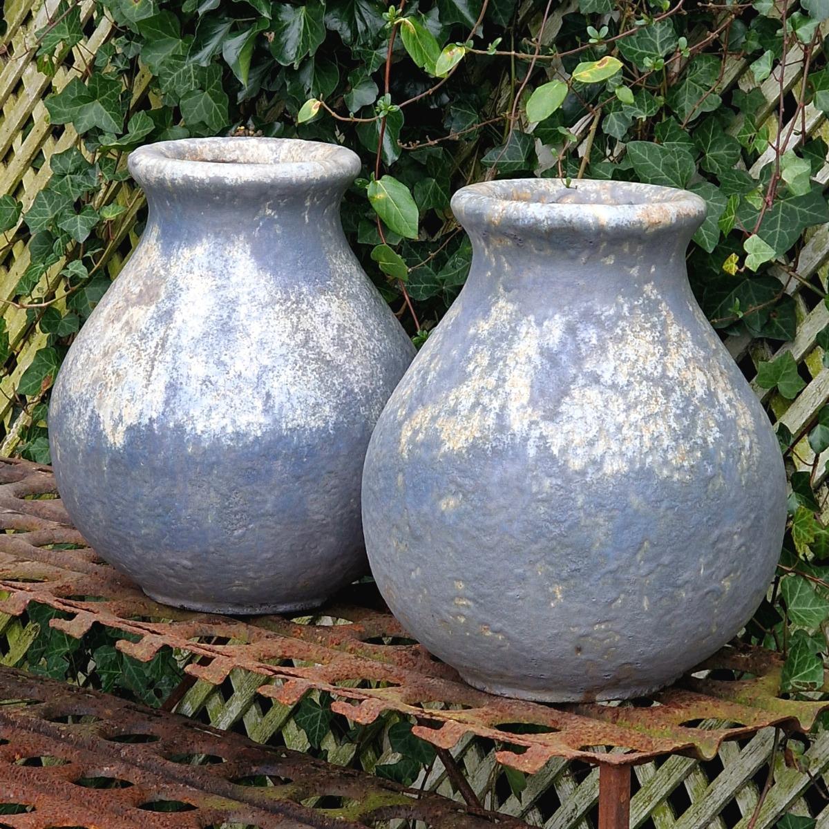 Pair of glazed terra cotta urns