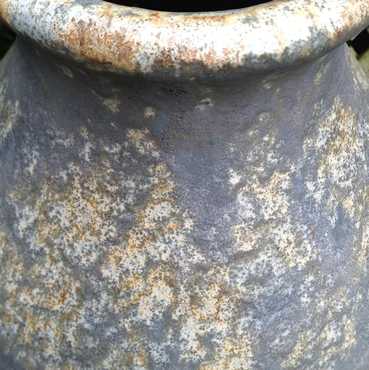 Pair of glazed terra cotta urns