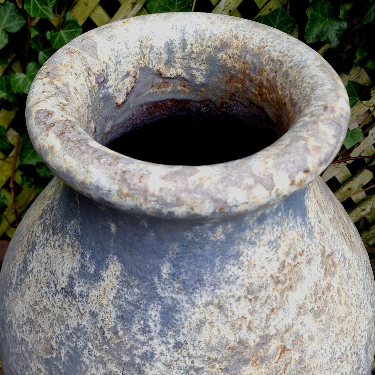 Pair of glazed terra cotta urns