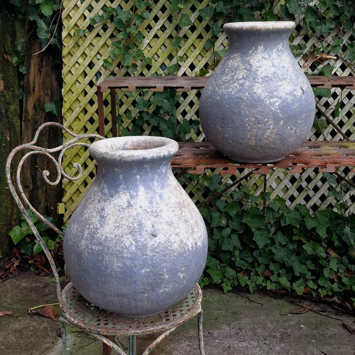 Pair of glazed terra cotta urns