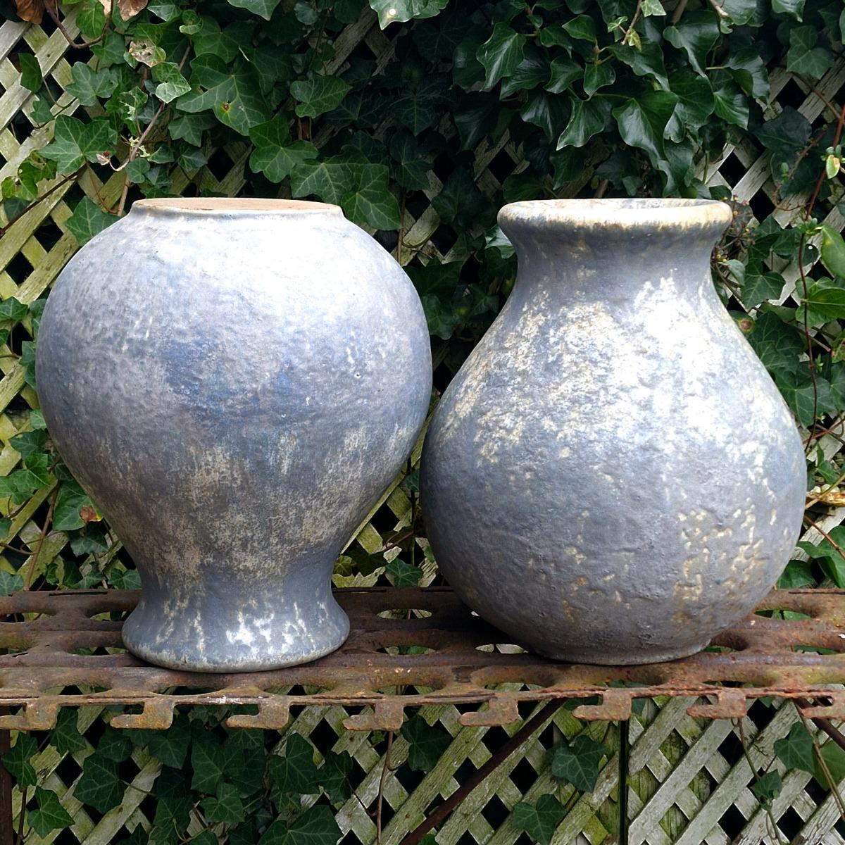 Pair of glazed terra cotta urns